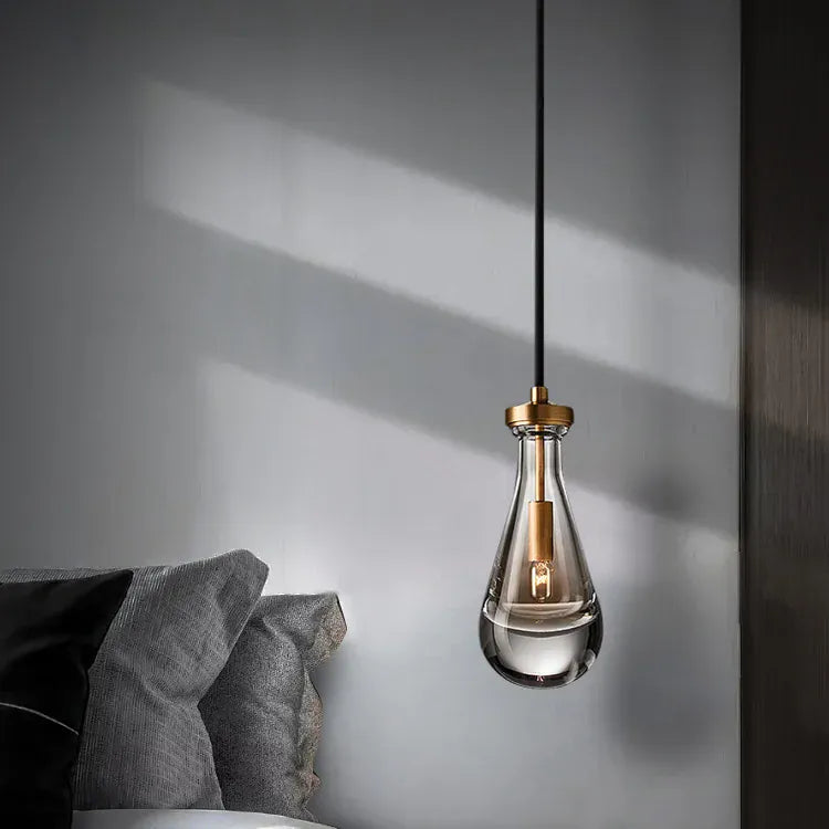 pendant light Suspension goutte d'eau en cuivre poli et verre translucide